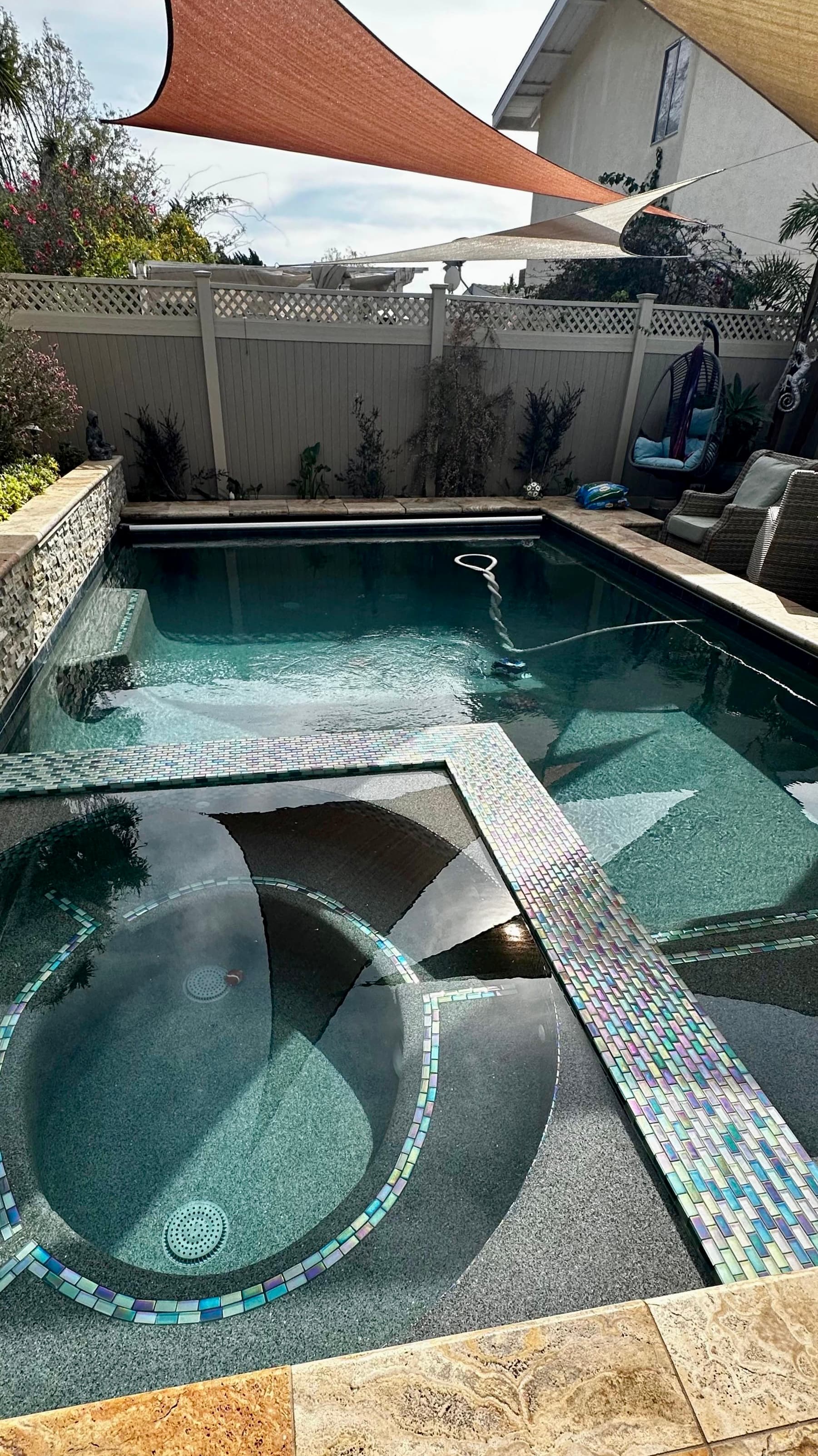 Pool and spa with mosaic tile detail
